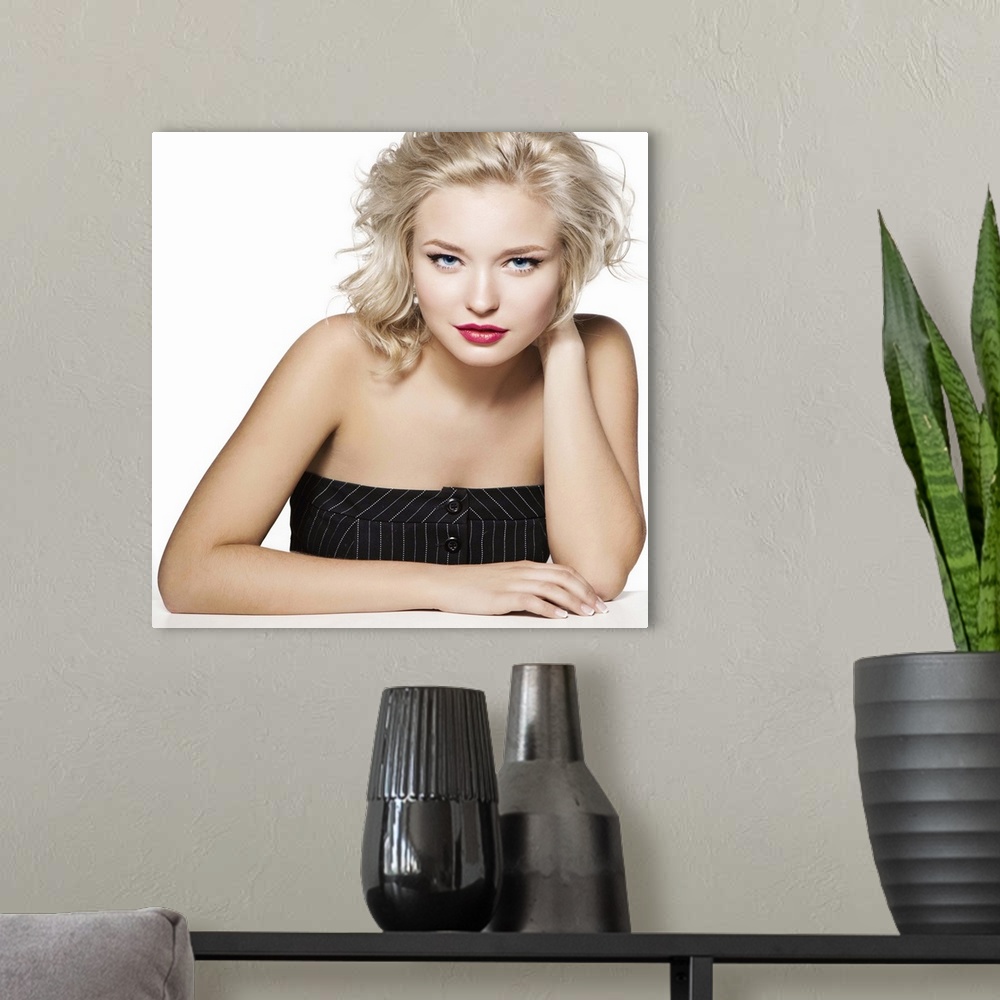 A modern room featuring Beauty portrait of young blonde, professional hairstyle and make-up
