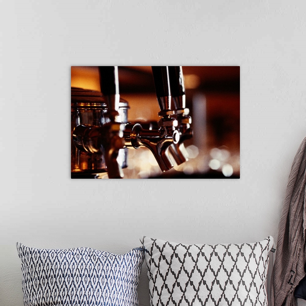 A bohemian room featuring Artwork perfect for the home or kitchen of beer taps at a bar.