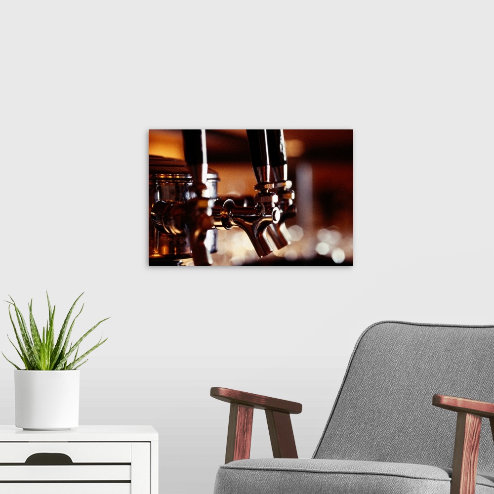 A modern room featuring Artwork perfect for the home or kitchen of beer taps at a bar.