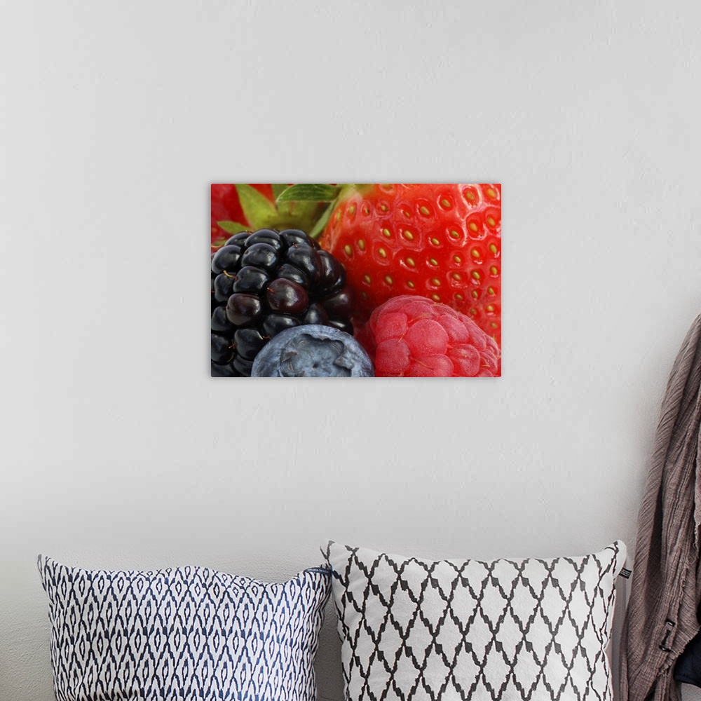 A bohemian room featuring Close-up of blackberry, blueberry and strawberries.