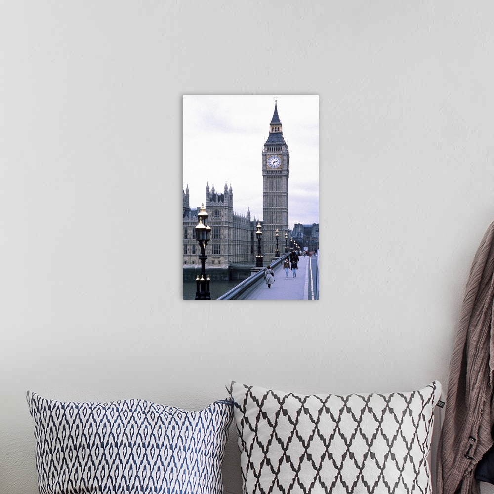 A bohemian room featuring Portrait, large photograph of people walking on Westminster Bridge, leading toward Big Ben toweri...