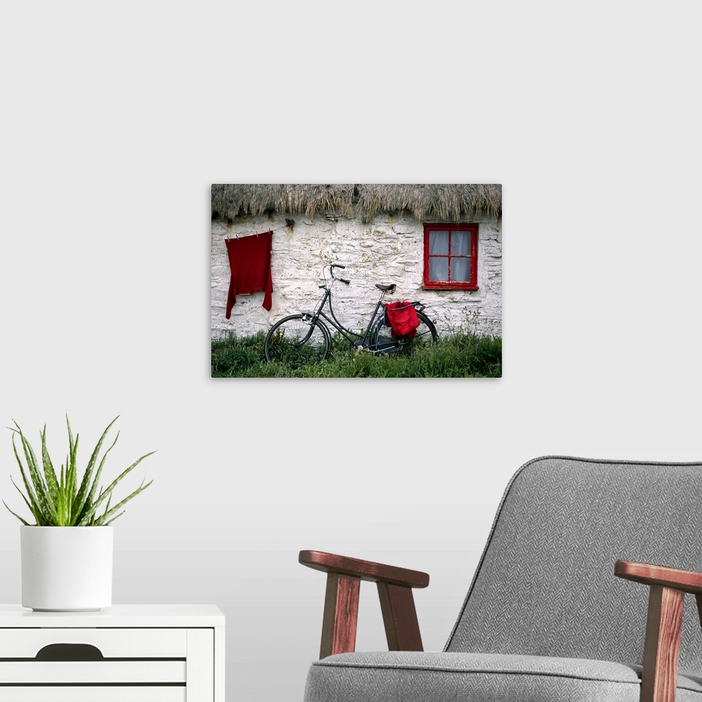 A modern room featuring Bike in front of cottage, Isle of Man