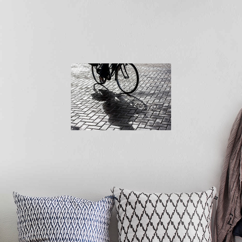 A bohemian room featuring Bike rider on streets of Amsterdam