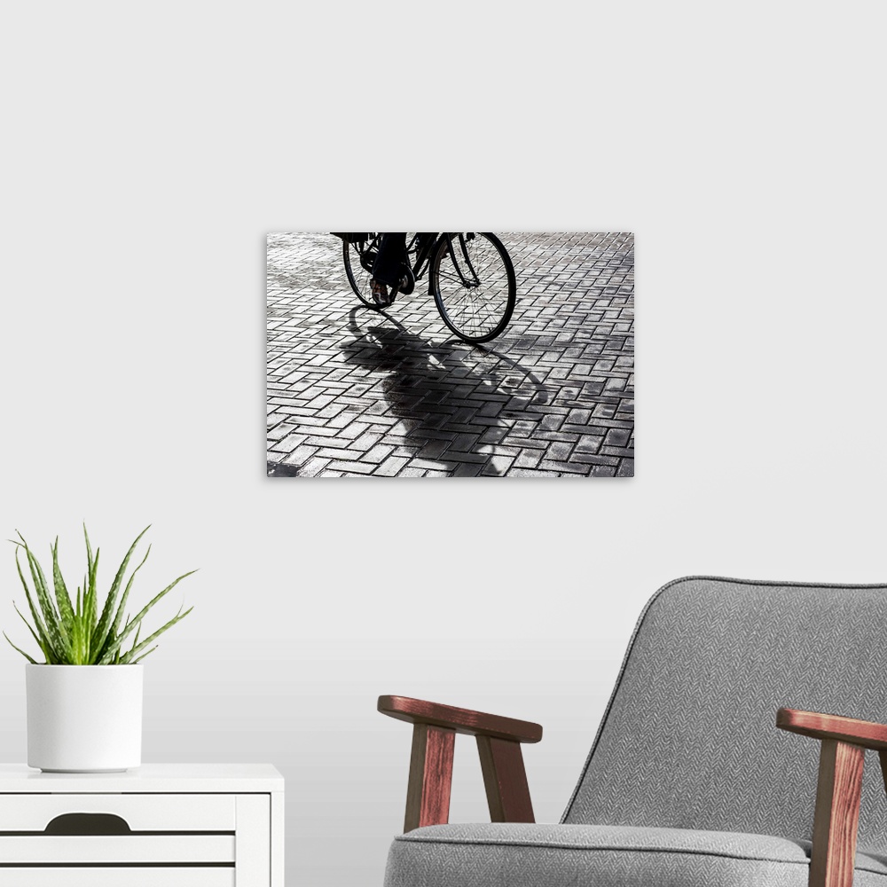 A modern room featuring Bike rider on streets of Amsterdam