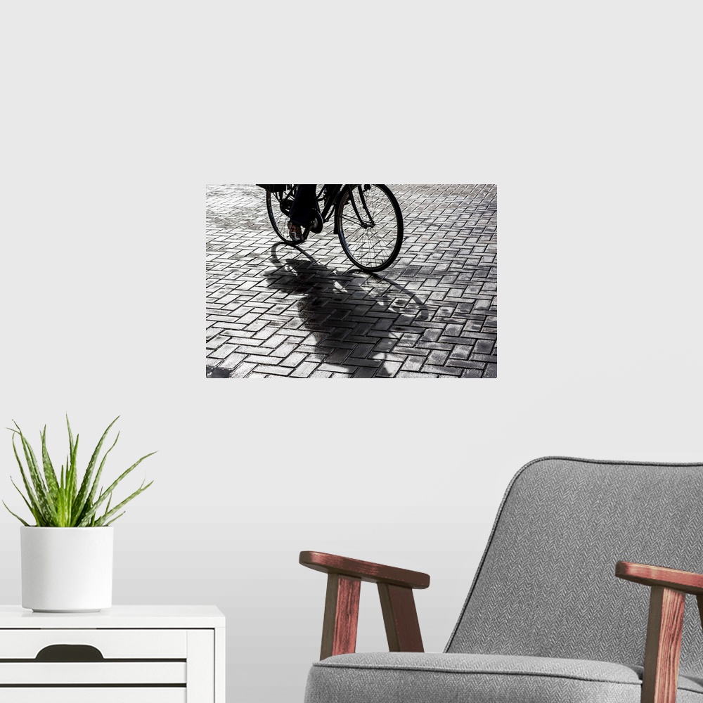 A modern room featuring Bike rider on streets of Amsterdam