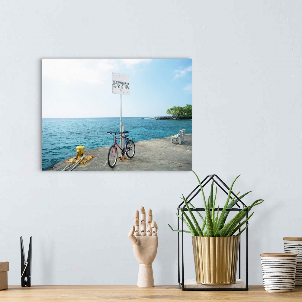 A bohemian room featuring Bike with the sea in the background