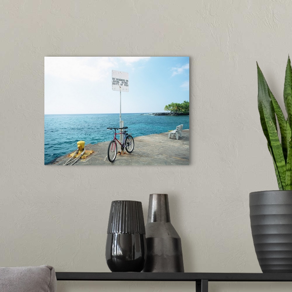 A modern room featuring Bike with the sea in the background