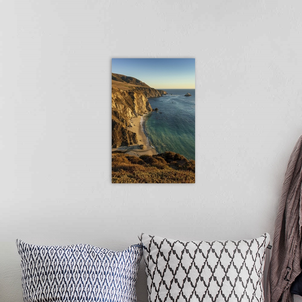 A bohemian room featuring A view of Bixby Creek entering the Pacific Ocean on California's Big Sur coastline at sunset look...