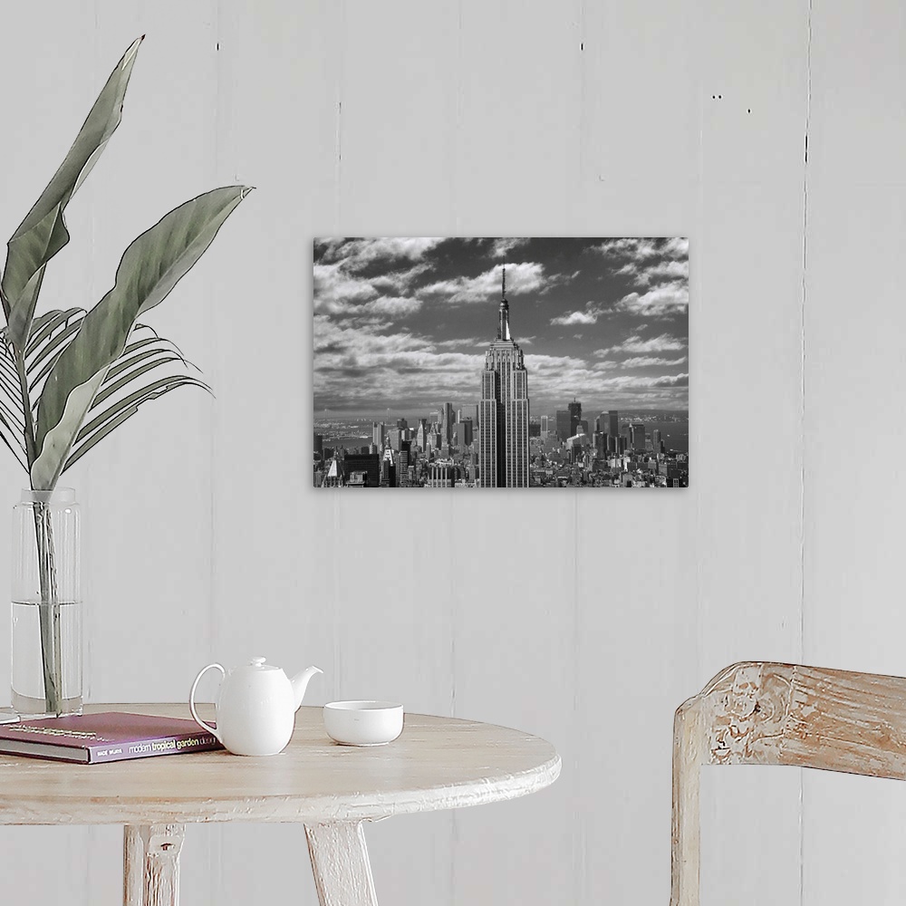 A farmhouse room featuring Black and white landscape photograph taken of the Empire State building with the skyline seen in ...