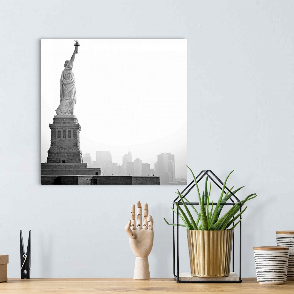A bohemian room featuring Black and white image of statue of Liberty with island of Manhattan/New York City in background.