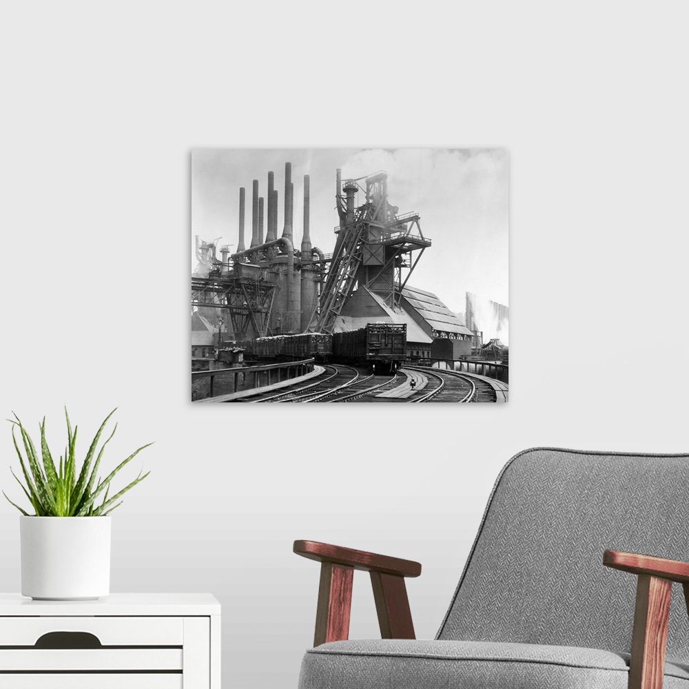 A modern room featuring Pittsburgh, PA. Blast furnaces of the Carnegie Steel Corp. Photograph shows an exterior of Steel ...