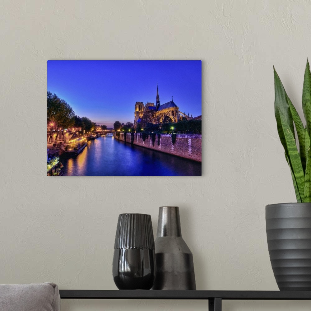 A modern room featuring Blue hour on Notre-Dame, Paris.