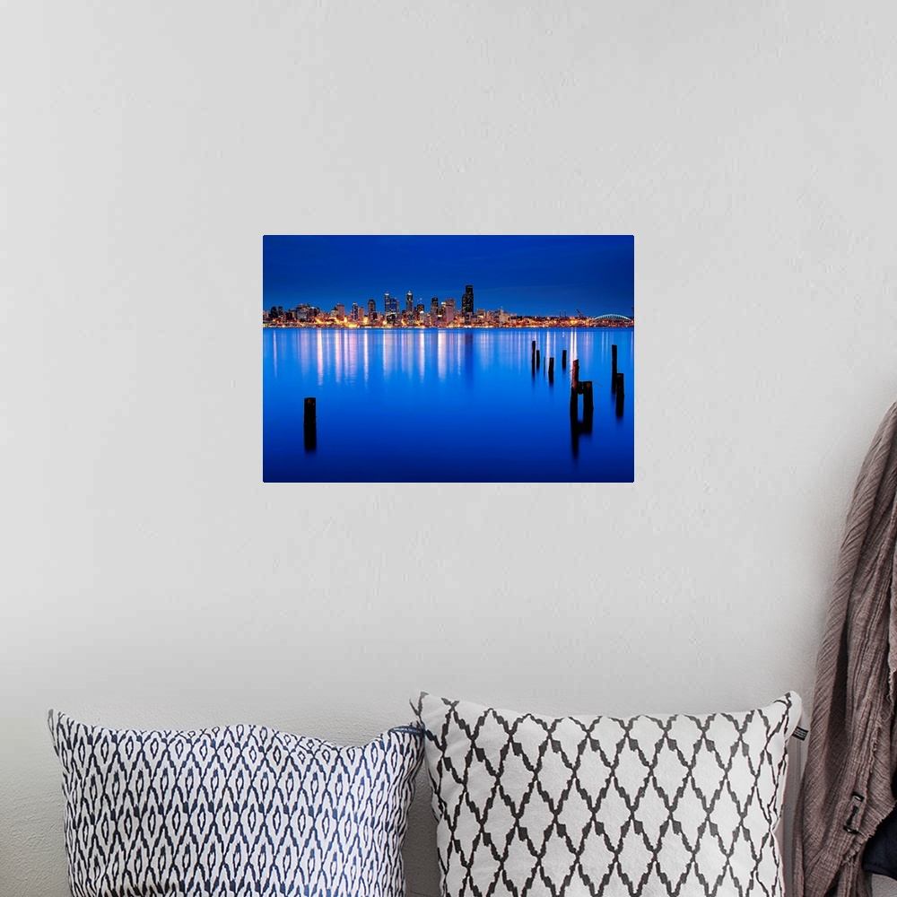 A bohemian room featuring Blue hour view of downtown Seattle across Elliott bay, from nearby Alki in West Seattle.