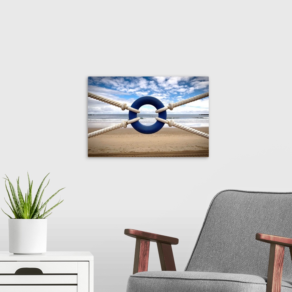 A modern room featuring Blue lifeguard and lonely beach.
