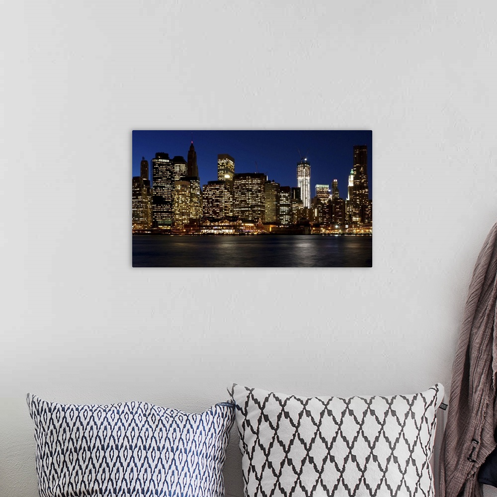 A bohemian room featuring Skyline of lower Manhattan from Brooklyn bridge park in early evening.