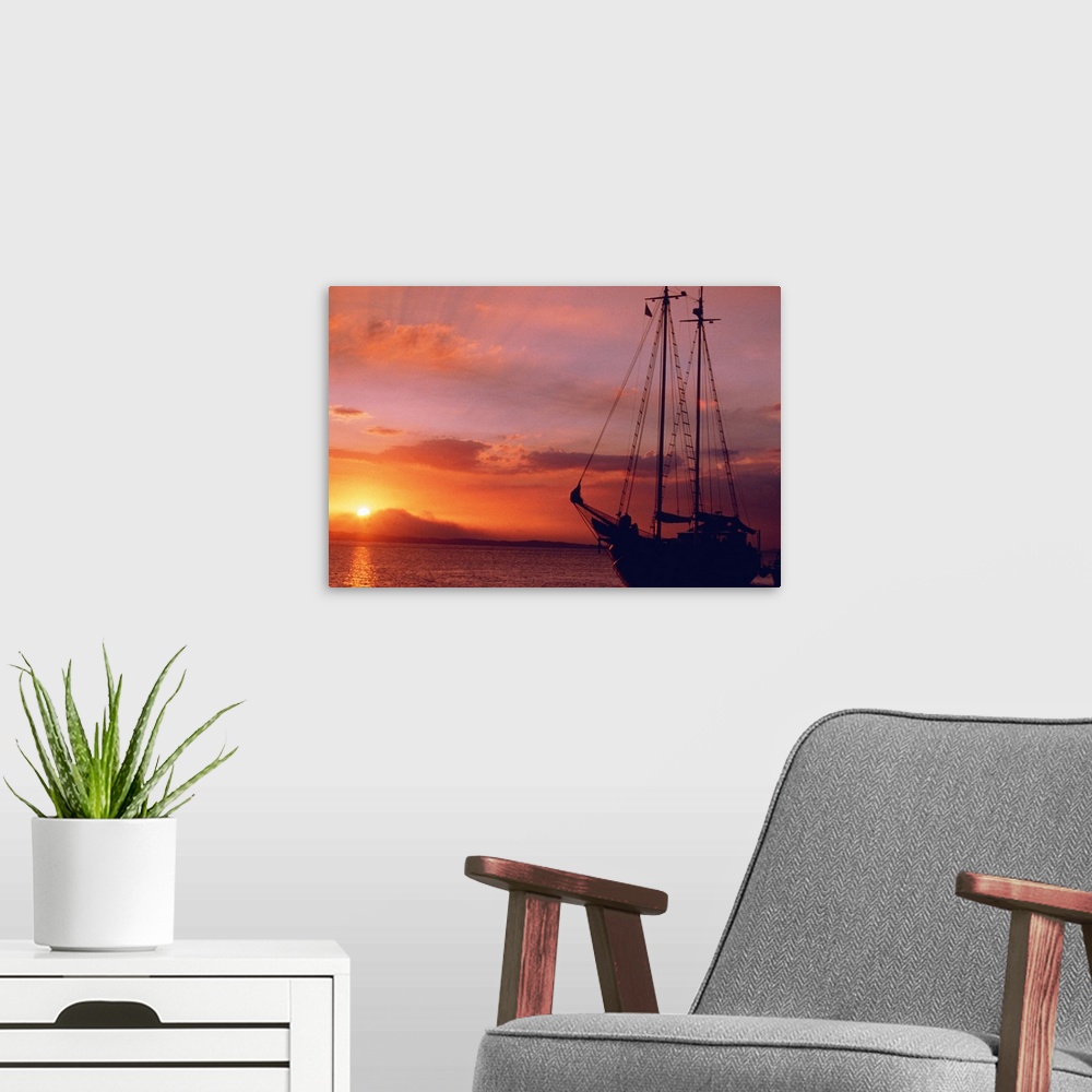 A modern room featuring boat at sunset