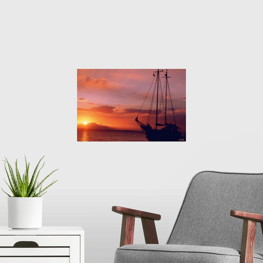 A modern room featuring boat at sunset
