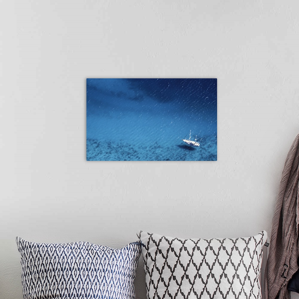 A bohemian room featuring Boat floating on ocean, Caribbean, aerial view