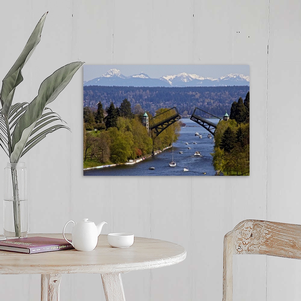 A farmhouse room featuring Landscape photograph on a large wall hanging of Montlake drawbridge, raised as boats pass under i...