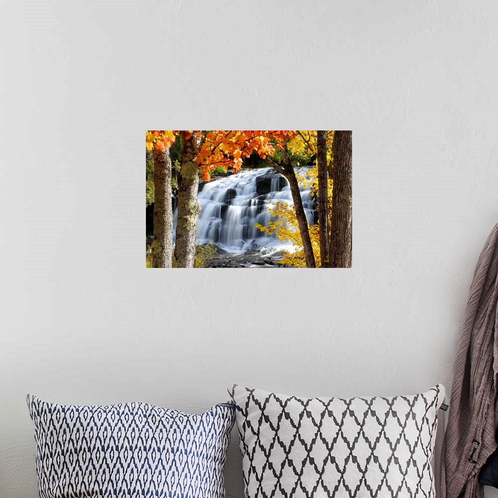 A bohemian room featuring Horizontal, photograph on a giant canvas of Bond Falls in Paulding, Michigan, cascading over rock...