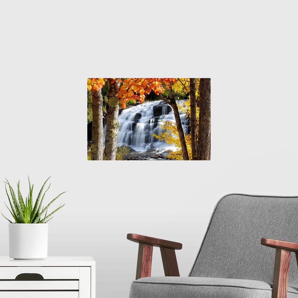 A modern room featuring Horizontal, photograph on a giant canvas of Bond Falls in Paulding, Michigan, cascading over rock...