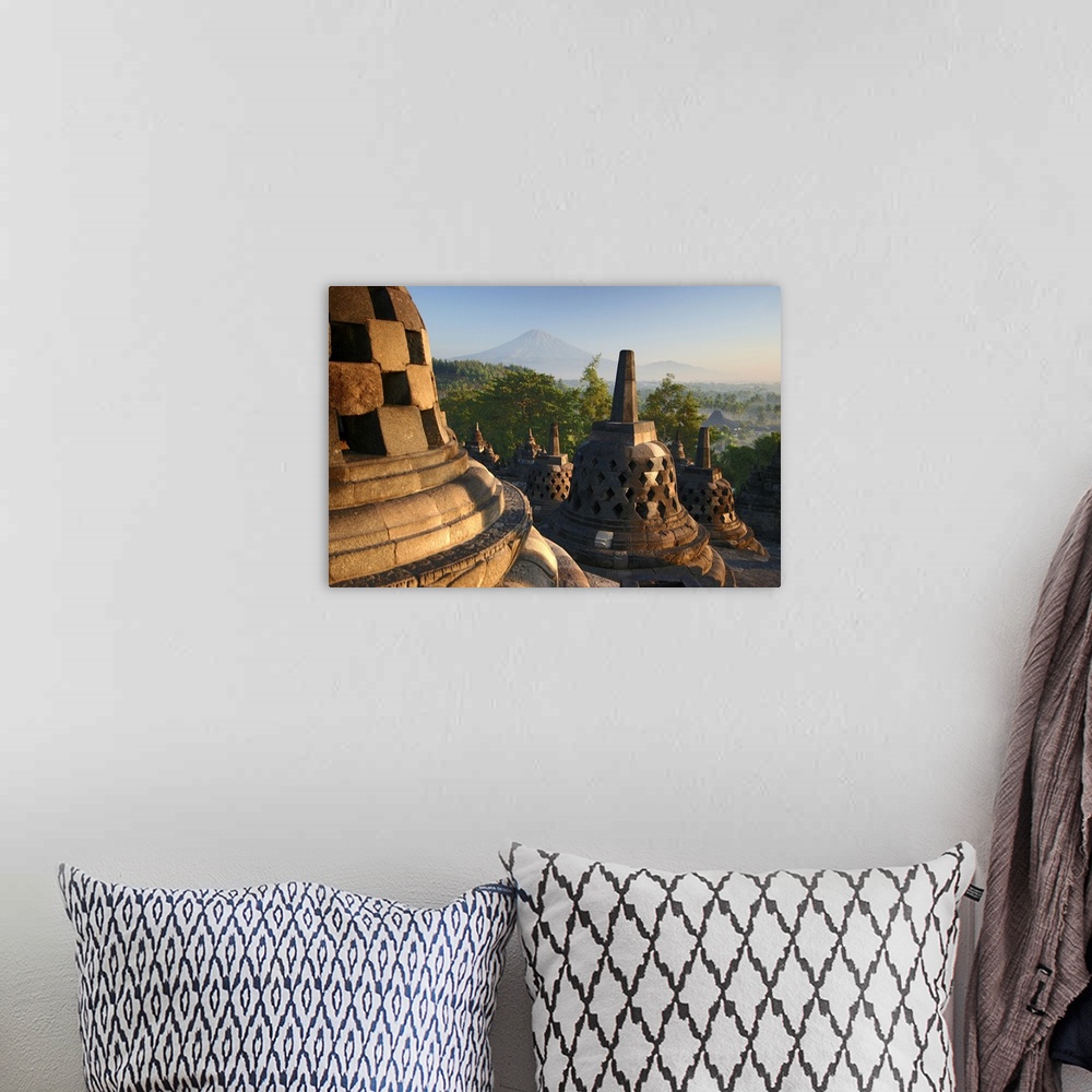 A bohemian room featuring Stupas on top of Borobudur temple, early morning light.  A UNESCO World Heritage site, built betw...