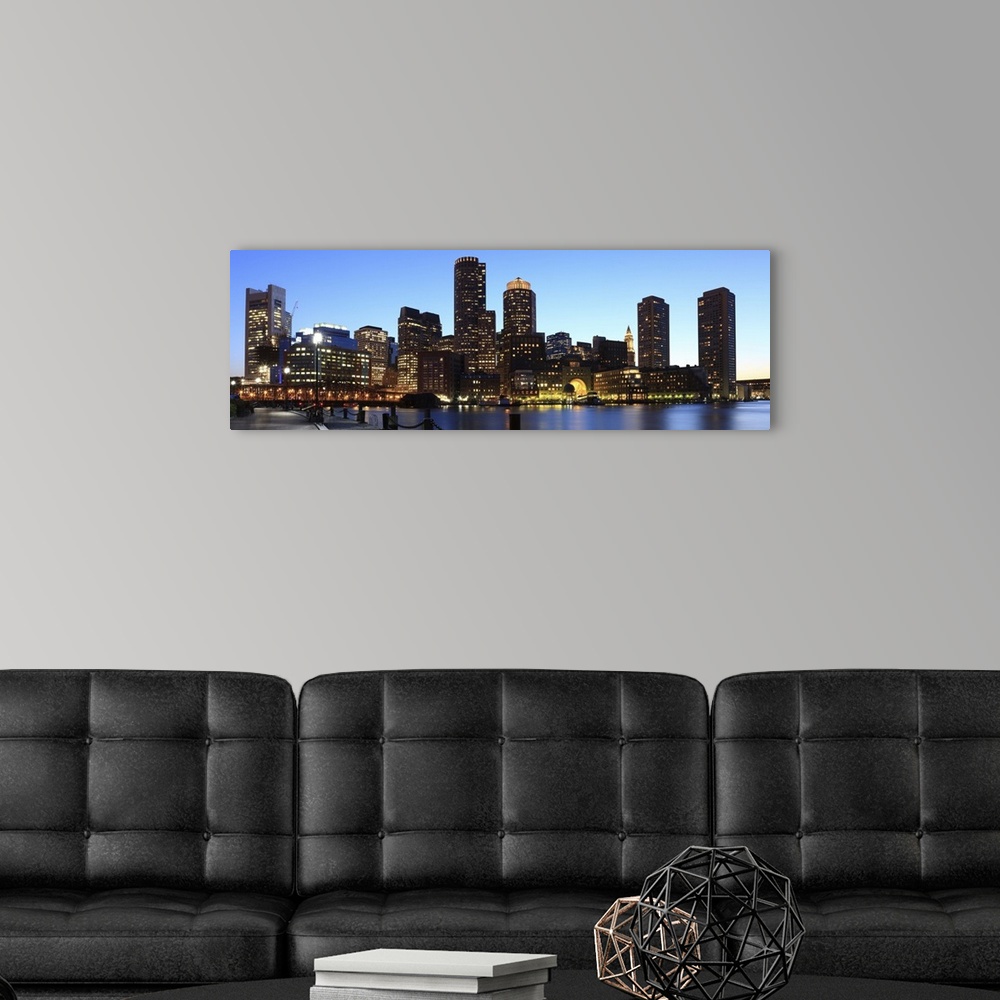 A modern room featuring Skyline of downtown Boston's financial district from inner Boston Harbor, at dusk