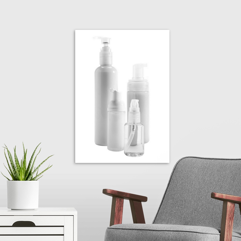 A modern room featuring Bottles of skin care products on white background
