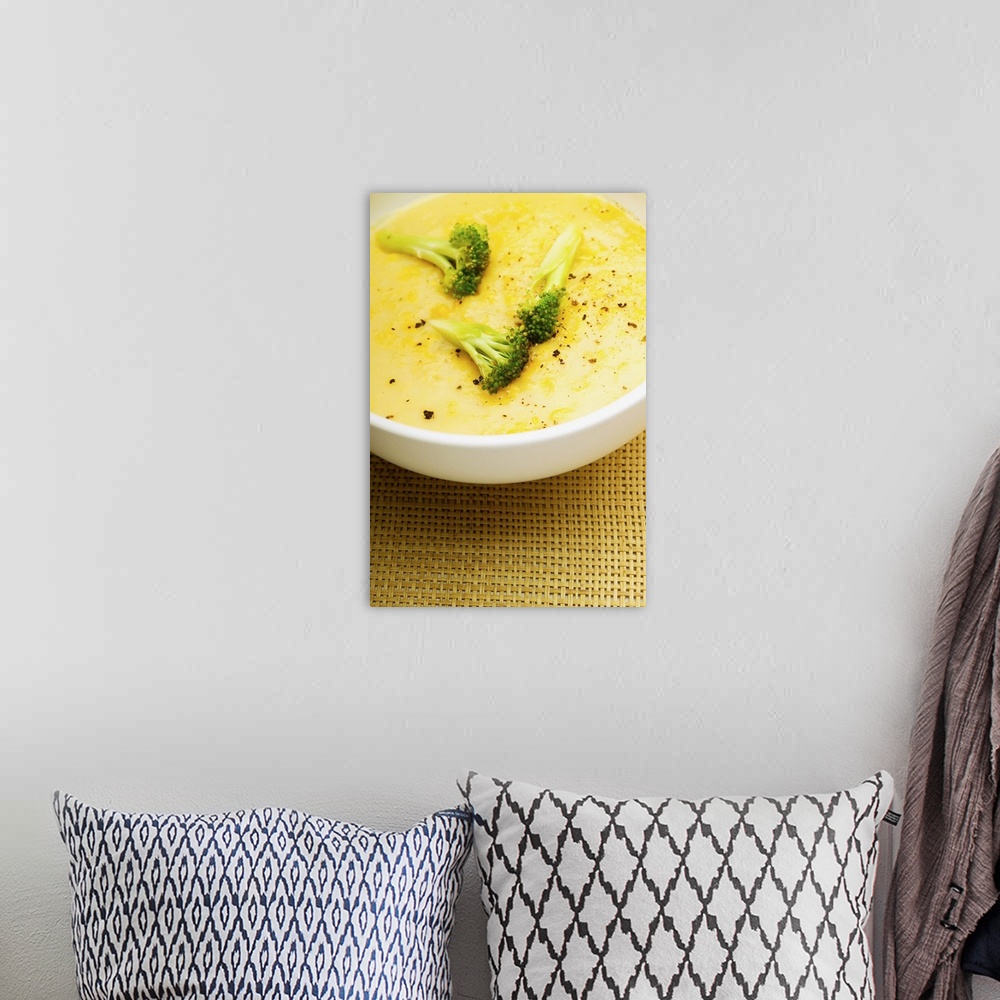 A bohemian room featuring Bowl of broccoli soup, close-up