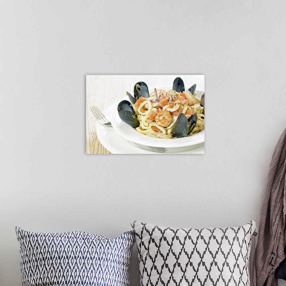 A bohemian room featuring Bowl of fresh seafood and pasta