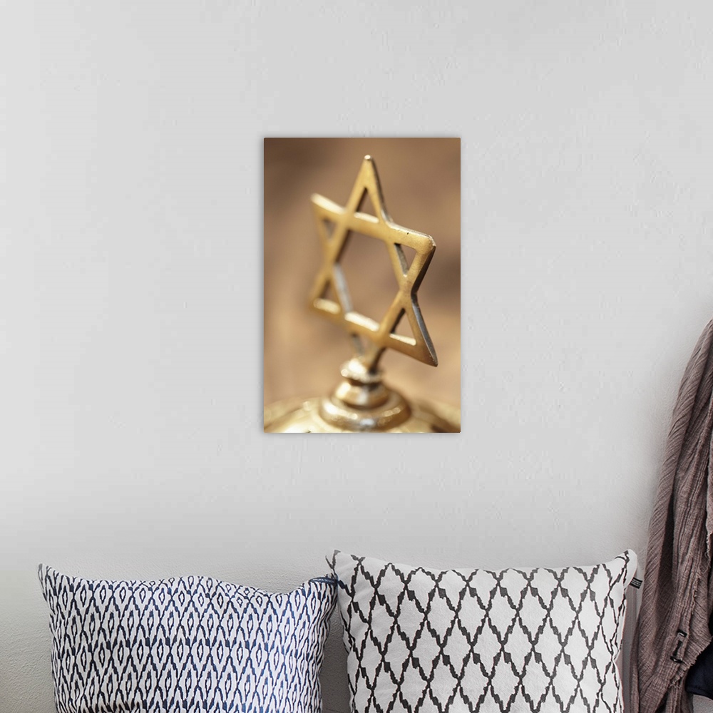 A bohemian room featuring Brass Jewish cross on brown background
