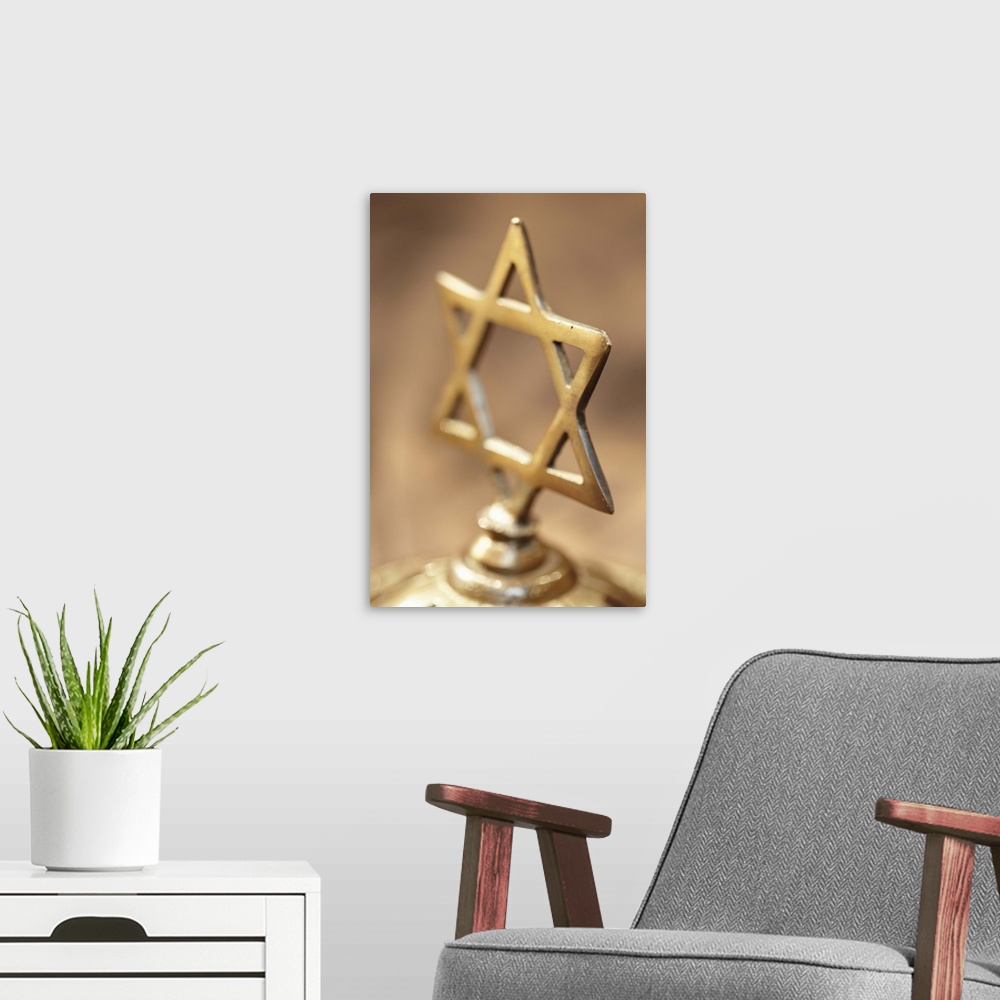 A modern room featuring Brass Jewish cross on brown background