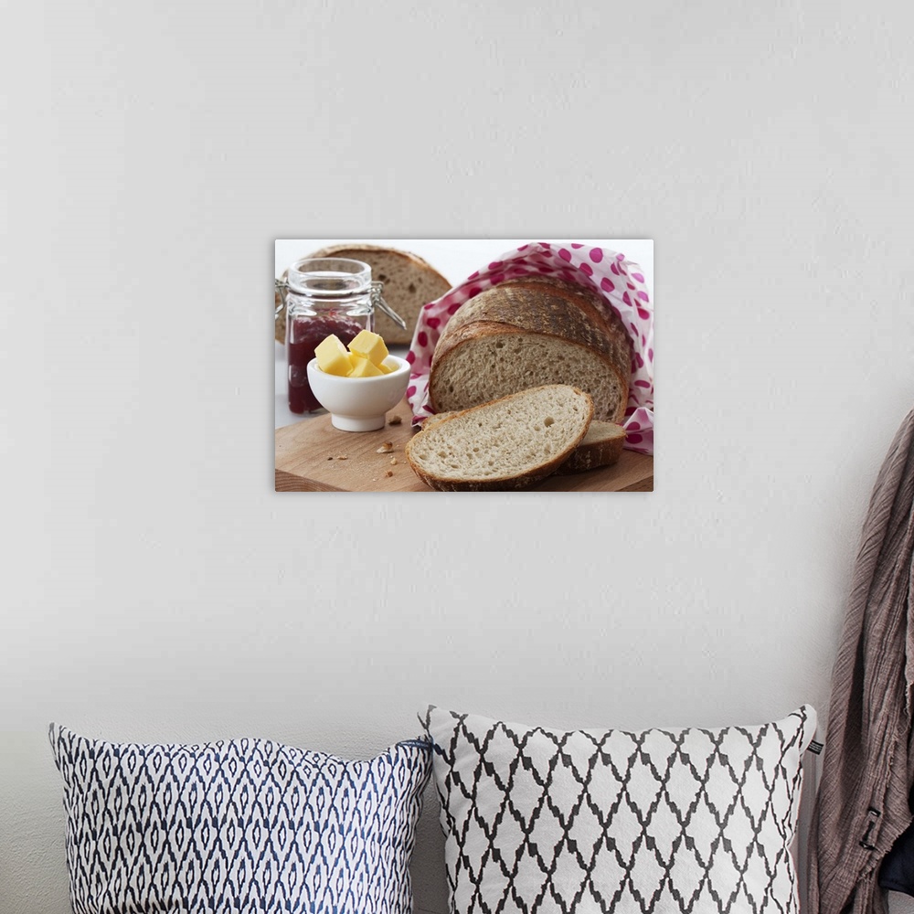 A bohemian room featuring Bread, butter and jam on chopping board
