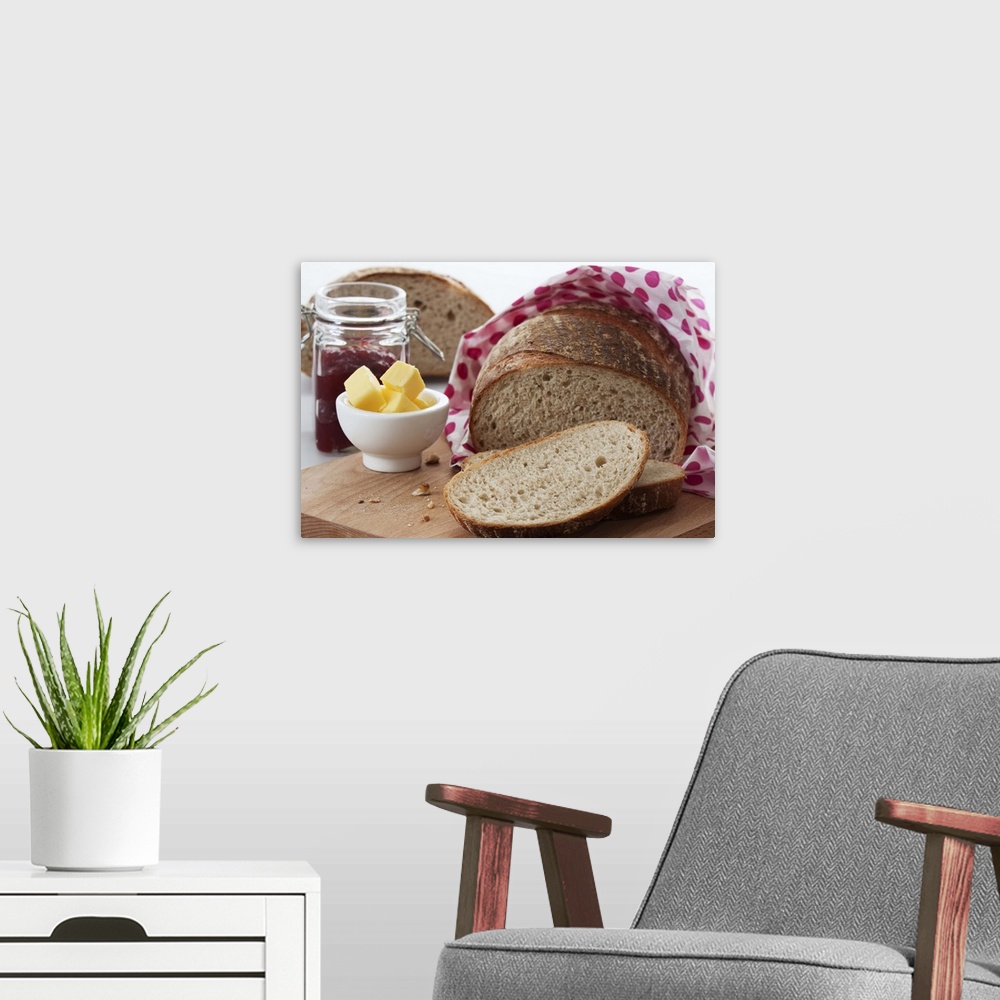 A modern room featuring Bread, butter and jam on chopping board