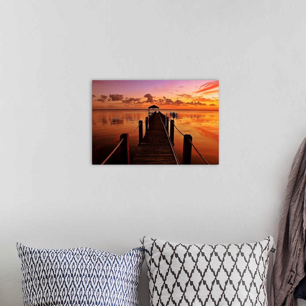 A bohemian room featuring This photograph is a gorgeous landscape of a narrow dock in the Currituck Sound at sunset in the ...