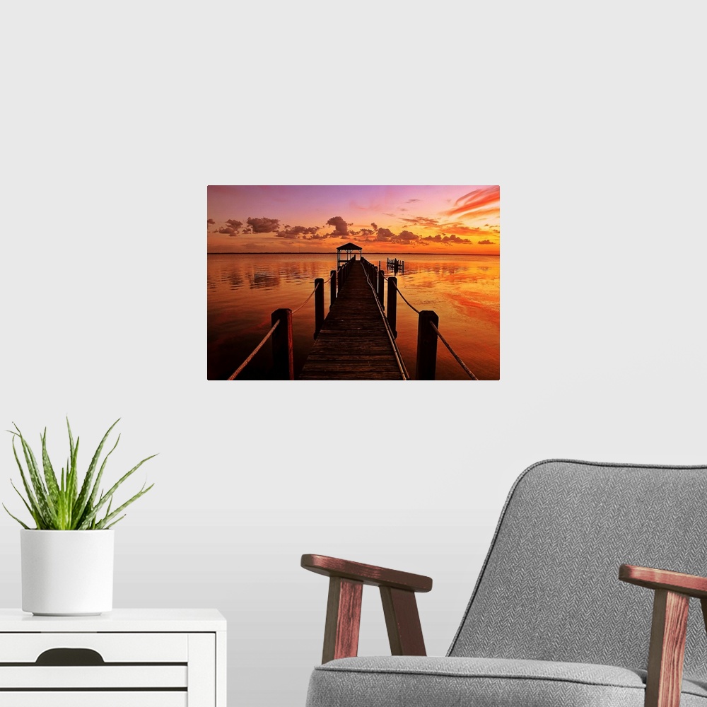 A modern room featuring This photograph is a gorgeous landscape of a narrow dock in the Currituck Sound at sunset in the ...