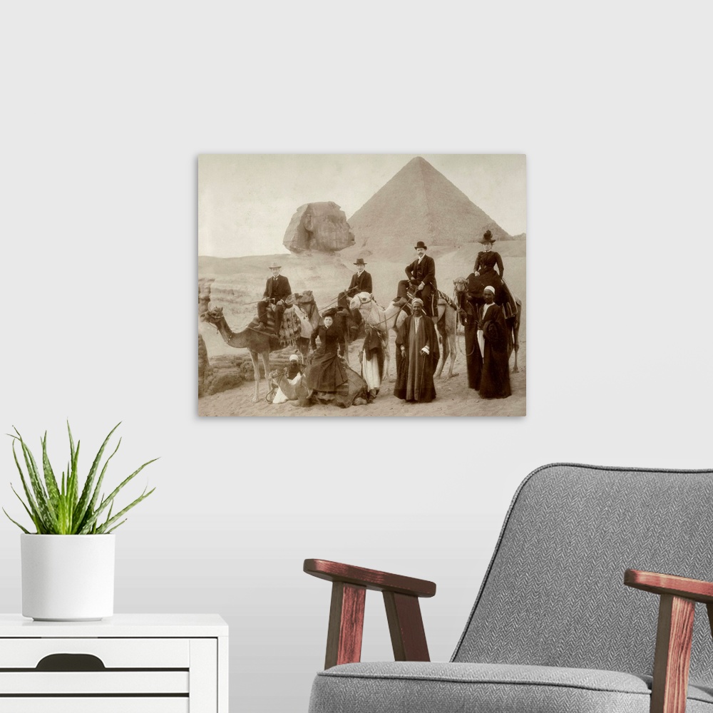 A modern room featuring Victorian or Edwardian tourists in front of the Great Pyramid Egypt.