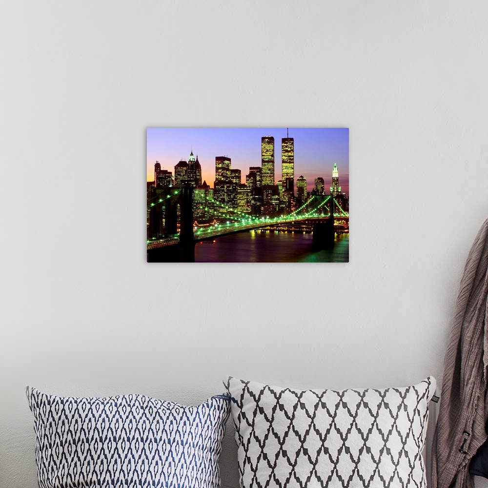 A bohemian room featuring Brooklyn Bridge and Manhattan skyline at dusk, New York