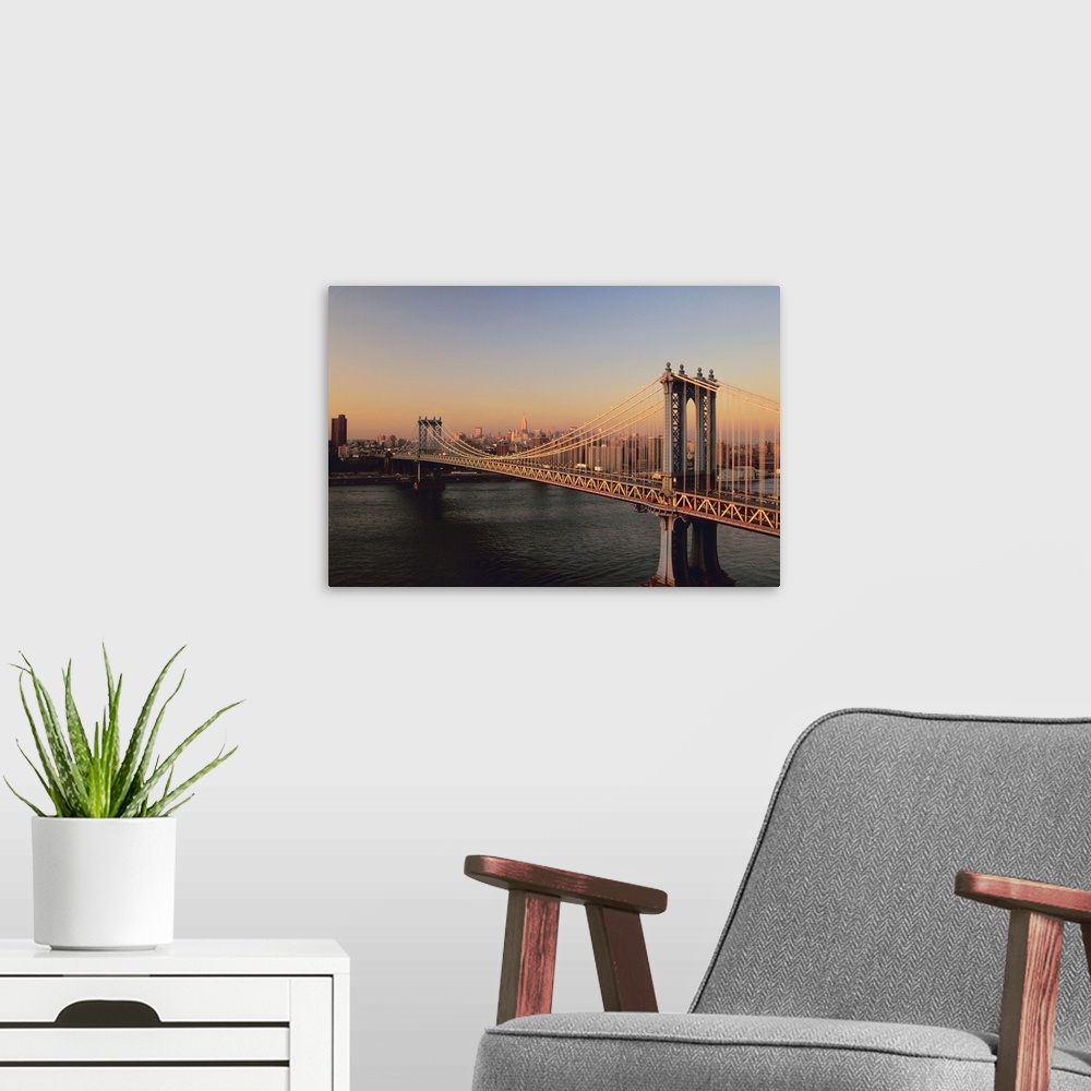 A modern room featuring Brooklyn Bridge at dusk in New York
