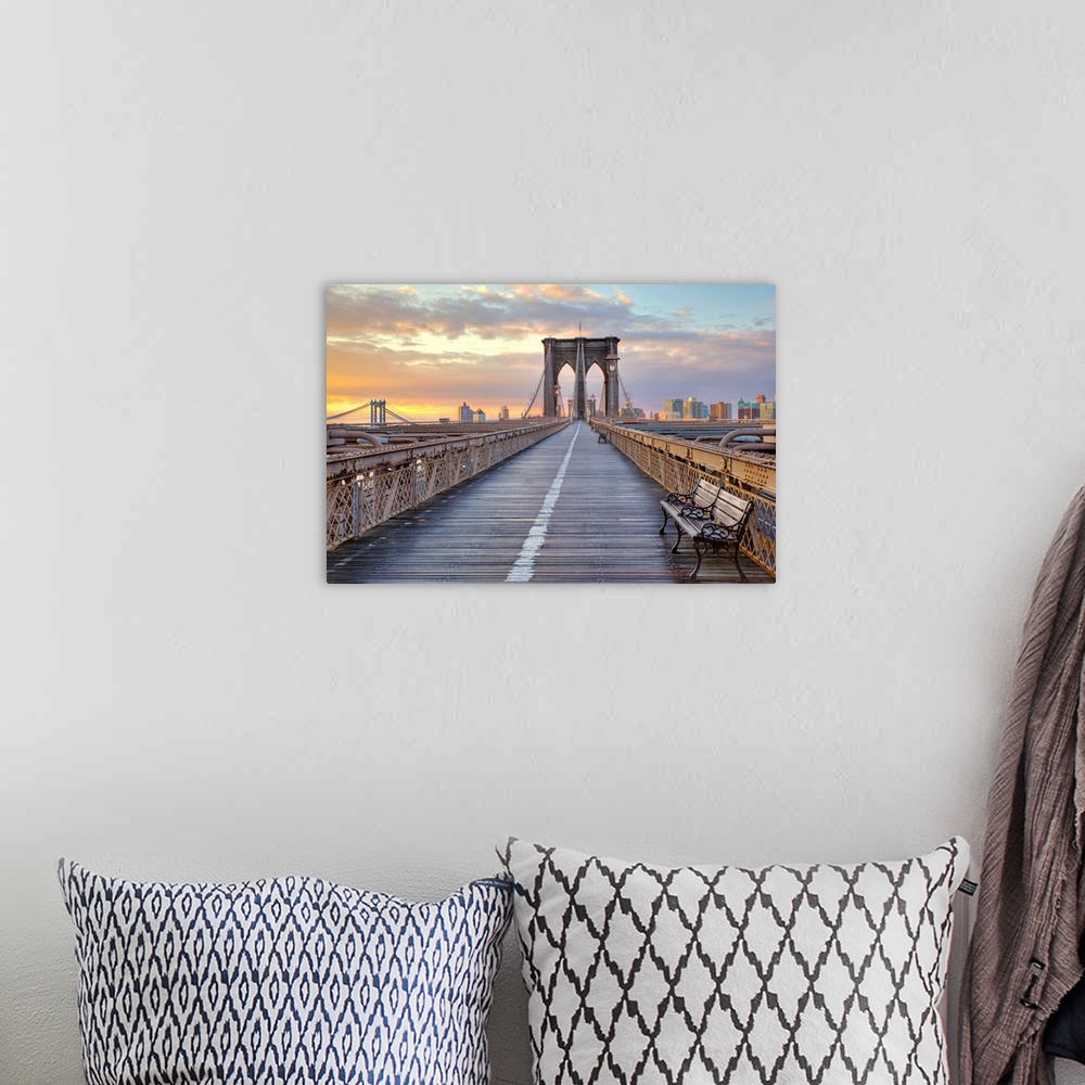 A bohemian room featuring Dusk picture taken on the Brooklyn Bridge looking down the pedestrian walkway towards Brooklyn.