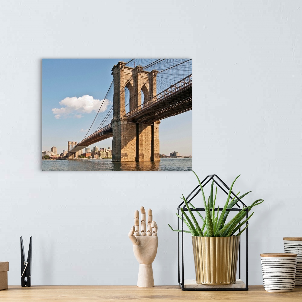 A bohemian room featuring Brooklyn Bridge seen in lower Manhattan waterfront, New York.