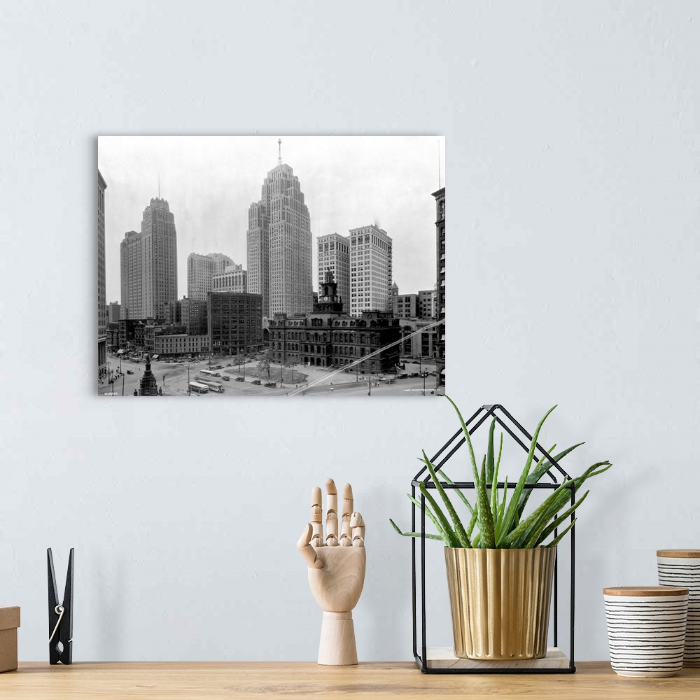 A bohemian room featuring The Guardian Building (tall tower on l) and the Penobscot Building (tall tower on r) tower over a...