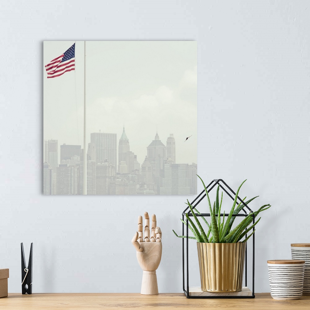 A bohemian room featuring Buildings of Manhattan with United States flag flying in foreground.