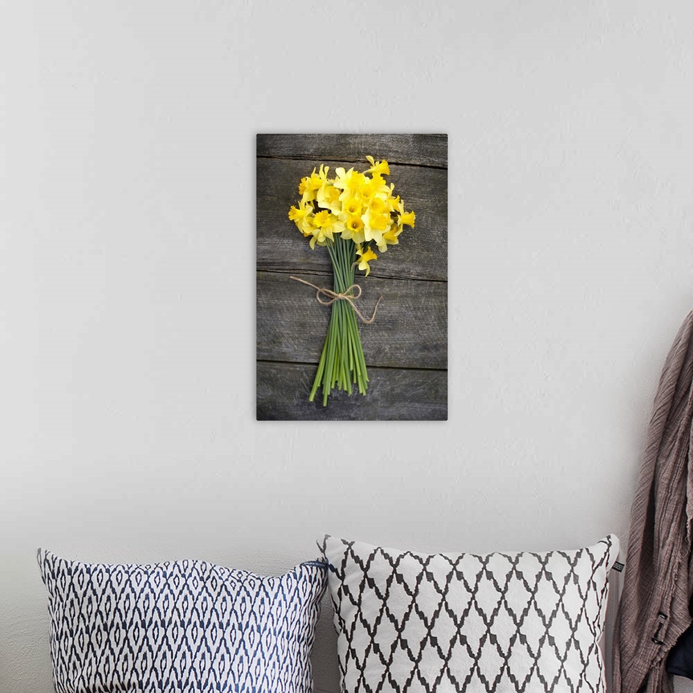 A bohemian room featuring Bunch of daffodils on a wooden table