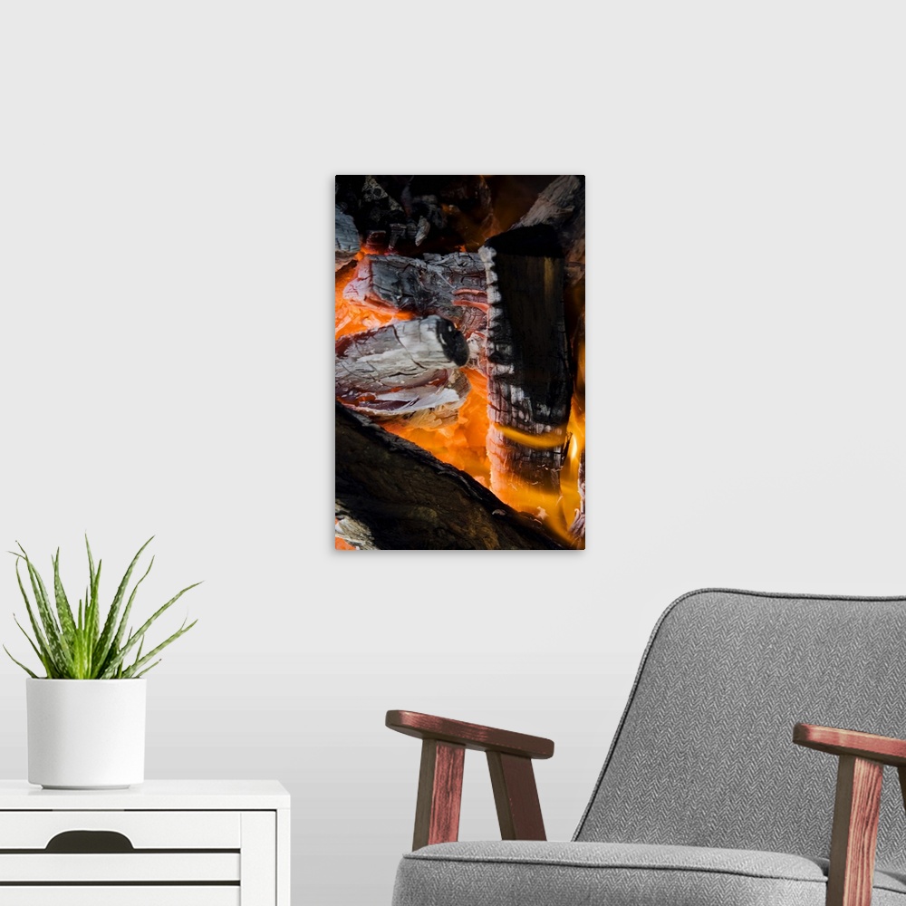 A modern room featuring Burning firewood