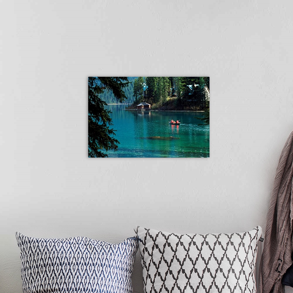 A bohemian room featuring Canoeing in a river surrounded by forest