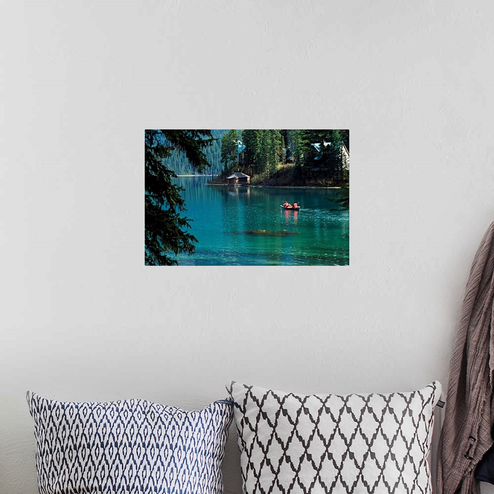 A bohemian room featuring Canoeing in a river surrounded by forest