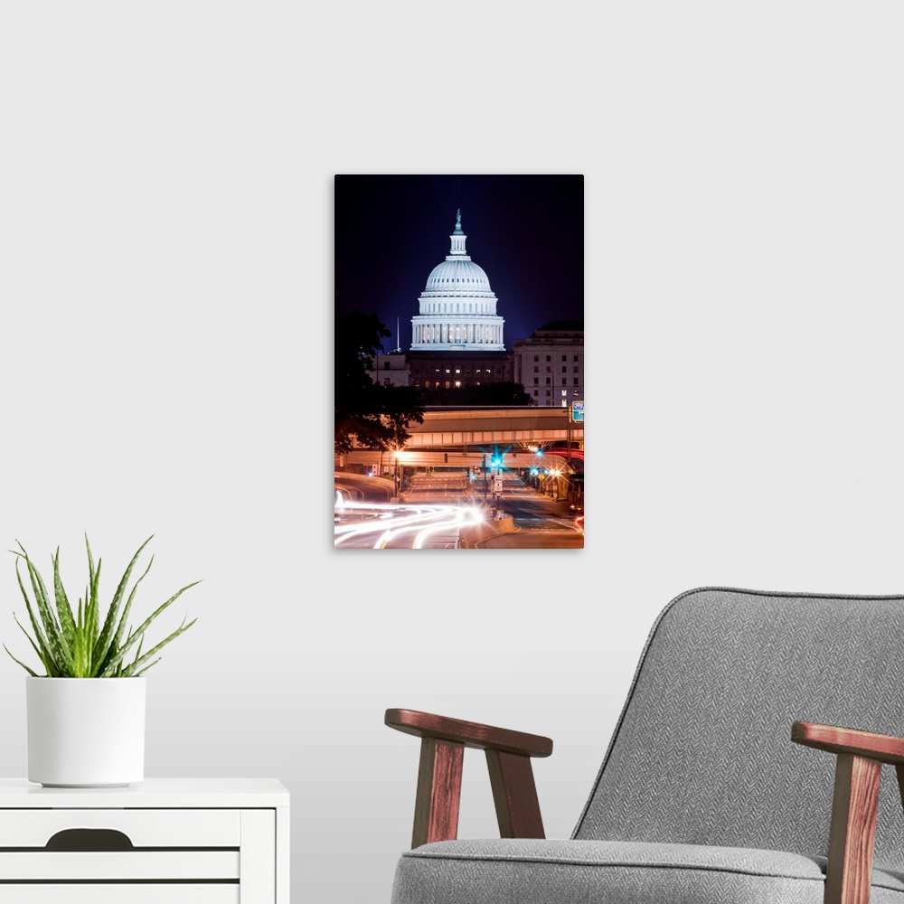 A modern room featuring USA, District of Columbia, Washington, DC, Capitol Building looms above traffic along New York Av...