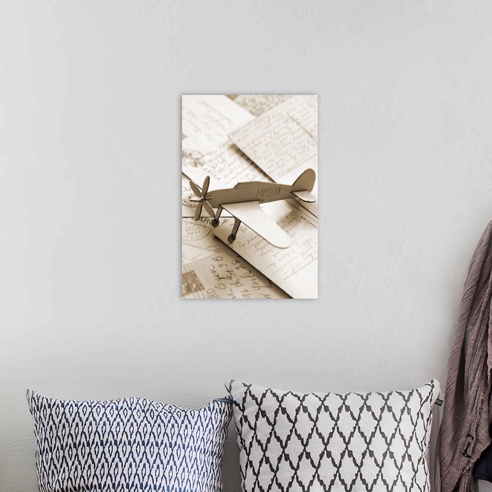 A bohemian room featuring Carboard airplane on postcards