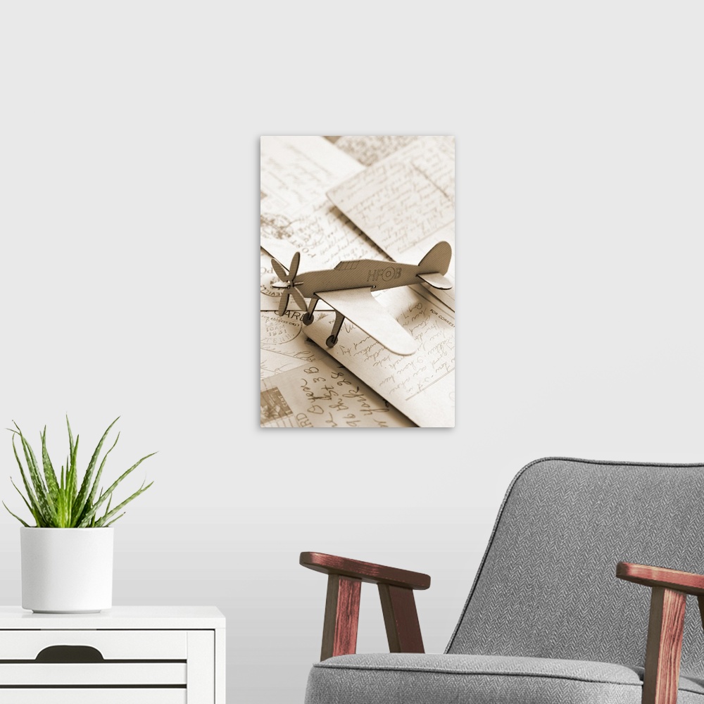 A modern room featuring Carboard airplane on postcards